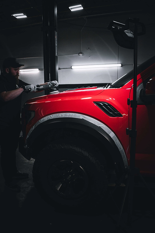 polishing red suv